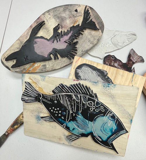 Wood block prints of fish 