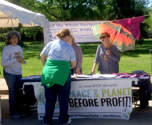 St. Louis WILPF branch members table on Earth Day 
